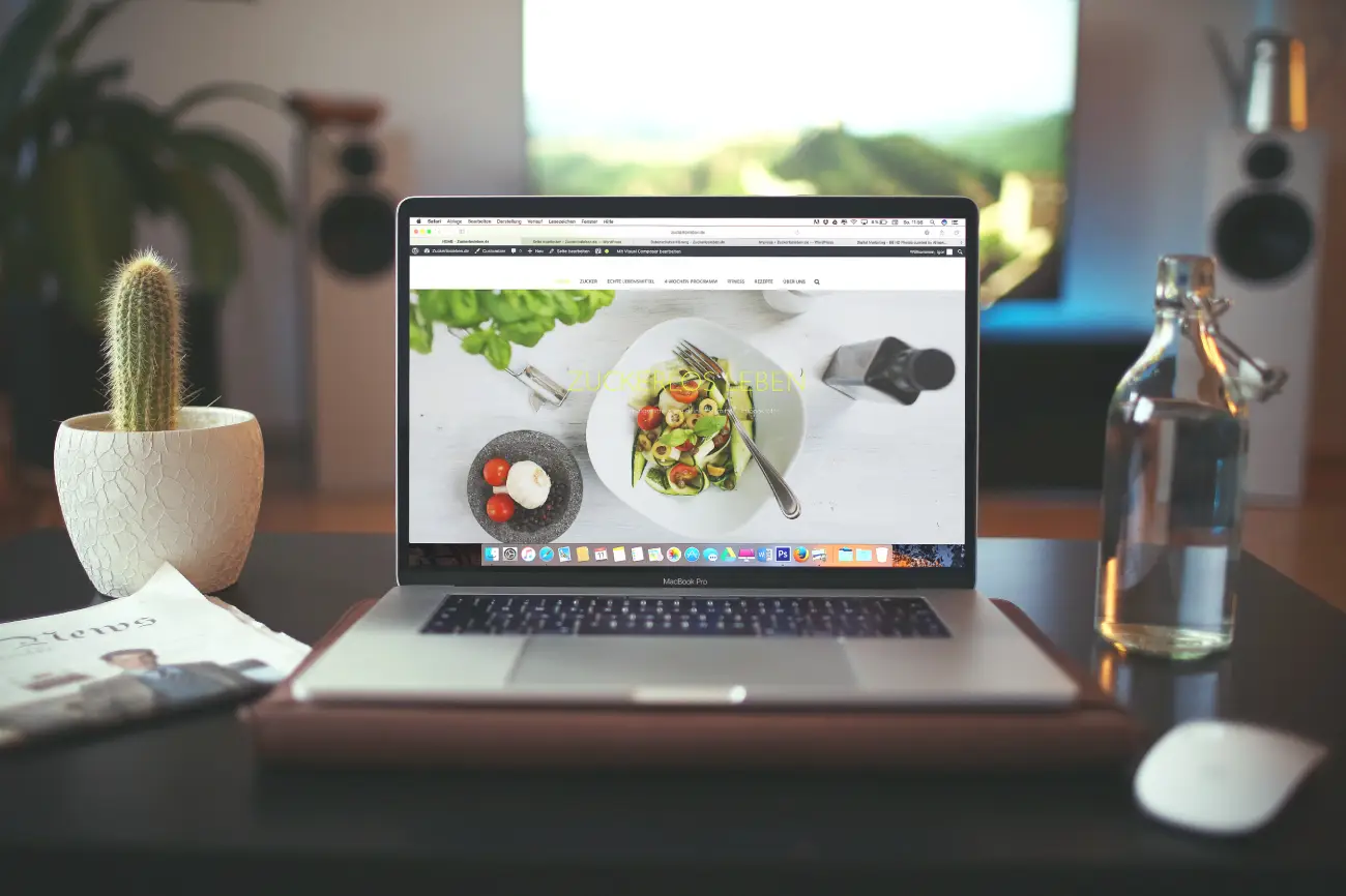 Image of a laptop showing a website.